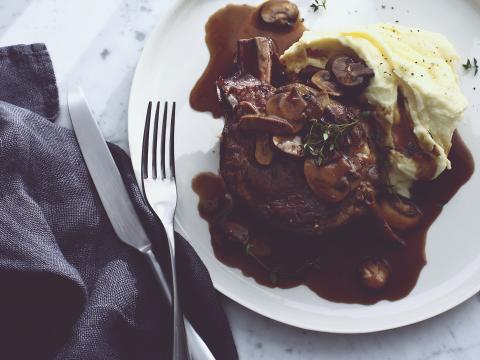 Steak with mushrooms and potatoes --- Image by © Brett Stevens/cultura/Corbis