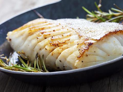 Fried fish fillet, Atlantic cod with rosemary in pan; Shutterstock ID 266014253