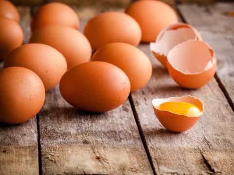 Fresh farm eggs on a wooden rustic background; Shutterstock ID 236452465