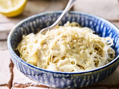 Grater peel and orange and lemon zest on the wooden table