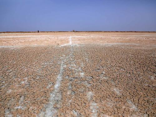 This picture shows the dried-up Sawa Lake in Iraq's southern province of al-Muthanna, on April 19, 2022. - In Sawa, a sharp drop in rainfall -- now only at 30 percent of what used to be normal for the region -- has lowered the underground water table, itself drained by wells, said a senior advisor at Iraq's water resources ministry. (Photo by Asaad NIAZI / AFP)