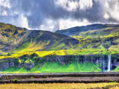 Panorama of volcanic massif Eyjafjoll with Seljalandsfoss and Gljufrafoss waterfalls - South Iceland