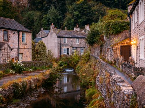 Iconic shot of Castleton, Peak District, Derbyshire, England. Photograph taken early morning on the bridge over Peakshole Water