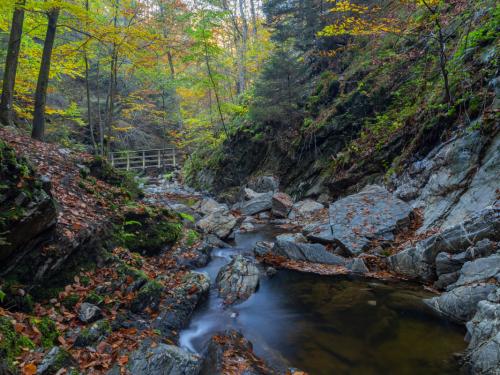 Autumn sunrise in the valley of Ninglinspo, which is classed as an outstanding heritage area of Wallonia. The stream forms rapids around enormous blocks, forming a series of pools with evocative names