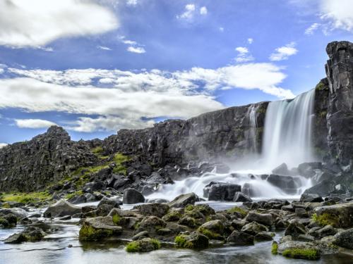 Oxararfoss waterfall in Thingvellir National Park, Iceland. The Oxarar river runs through the break line between two tectonic plates.