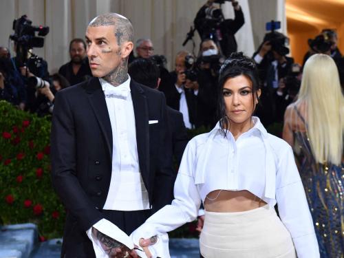 US socialite Kourtney Kardashian and US musician Travis Barker arrive for the 2022 Met Gala at the Metropolitan Museum of Art on May 2, 2022, in New York. - The Gala raises money for the Metropolitan Museum of Art's Costume Institute. The Gala's 2022 theme is "In America: An Anthology of Fashion". (Photo by ANGELA  WEISS / AFP)