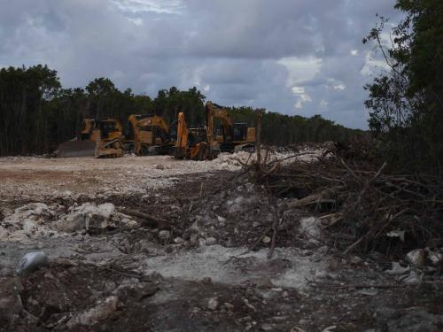 Heavy machinery remains parked at the construction site of Section 5 South of the Mayan Train between the resorts of Playa del Carmen and Tulum which was halted by a district judge pending resolution of an injunction sought by scuba divers and environmentalists -- in Playa del Carmen, Quintana Roo State, Mexico, on April 26, 2022. - A Mexican judge earlier this month suspended construction of part of President Andres Manuel Lopez Obrador's flagship tourist train project in the Yucatan peninsula due to a lack of environmental impact studies. The Mayan Train, a roughly 1,500-kilometre (950 mile) rail loop linking popular Caribbean beach resorts and archeological ruins, has met with opposition from environmentalists and indigenous communities. (Photo by Pedro PARDO / AFP)