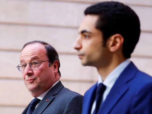 France's former President Francois Hollande arrives at the Elysee presidential palace in Paris on May 7, 2022, to attend the investiture ceremony of Emmanuel Macron as French President, following his re-election last April 24. (Photo by GONZALO FUENTES / POOL / AFP)
