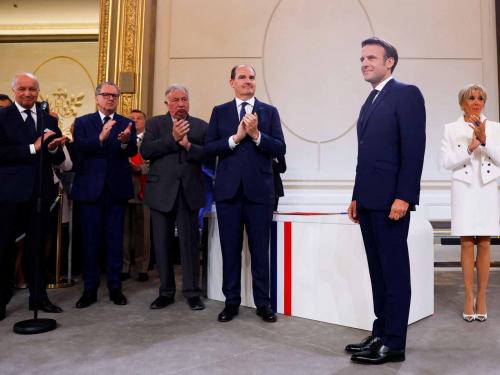 French President Emmanuel Macron is applauded as he is sworn-in for a second term as president of the Republique after his re-election on April 14, during a ceremony at the Elysee Palace in Paris on May 7, 2022. (Photo by GONZALO FUENTES / POOL / AFP)