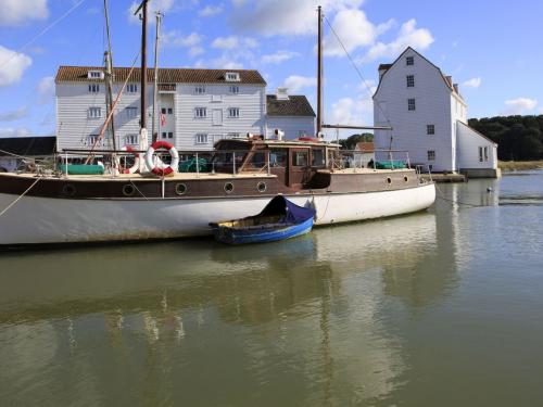 Historic boat and Tide Mill on the waterfront, River Deben, Woodbridge, Suffolk, England, UK. (Photo by: Geography Photos/Universal Images Group via Getty Images)