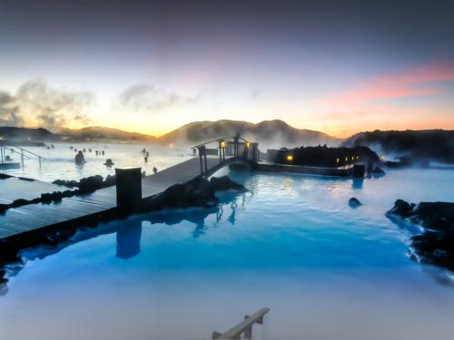 The sun was rising at the blue lagoon and it was a delight to swim in the warm baths with the outside temperature around zero degrees created a slight mist in the air as the cold air made contact to the warm water.