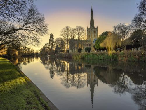 shakespeares burial place holy trinity church stratford-upon-avon  warwickshire the midlands england uk. reflections in the river avon.