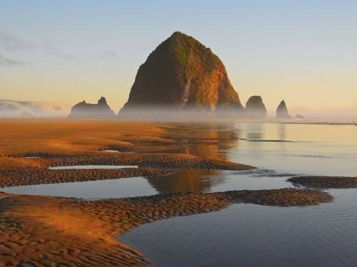 The Earth is the most beautiful artist and the sea keeps her company, as here in Cannon Beach, Oregon.