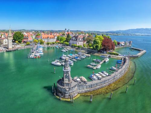 Harbor on Lake Constance with statue of lion at the entrance in Lindau, Bavaria, Germany