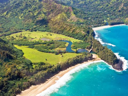 Aerial view from helicopter of the beautiful and dramatic scenic landscape of Lumahai Beach and Wainiha Bay of Kauai, Hawaii, USA. The beautiful beach is a popular tourist destination located on the north side of the island of Kauai.