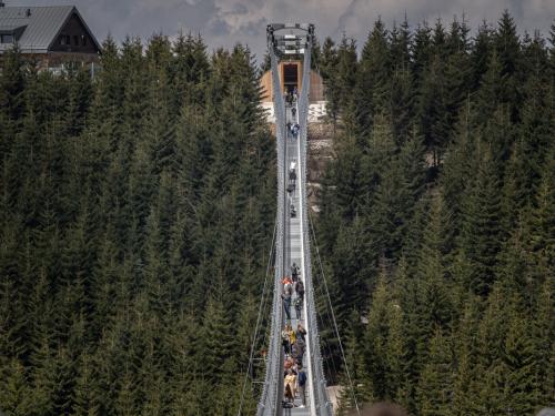 DOLNI MORAVA, CZECH REPUBLIC - MAY 9: Visitors walk on the Sky Bridge 721, the world's longest suspension pedestrian bridge in Dolni Morava, Czech Republic on May 9, 2022. Sky Bridge 721, the longest pedestrian bridge in the world with a length of 721 meters and an elevation of 95 meters above the ground, is located in the Pardubice region (a break between the Eagle Mountains and the Jesenice). (Photo by Lukas Kabon/Anadolu Agency via Getty Images)