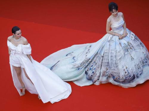 The 75th Cannes Film Festival - Opening ceremony and screening of the film "Coupez" (Final Cut) Out of competition - Red Carpet arrivals - Cannes, France, May 17, 2022. Emilia Schuele and a guest and arrive.