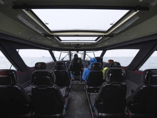 This picture taken on May 3, 2022 shows the inside of the Kvitbjorn (Polar Bear, in Norwegian), a hybrid touristic boat, combining a diesel motor and electric batteries, as it makes its way in the sea ice in the Borebukta Bay, located at the northwestern side of Isfjorden, in Svalbard Archipelago, northern Norway. - Home to polar bears, the midnight sun and the northern lights, a Norwegian archipelago perched high in the Arctic is trying to find a way to profit from its pristine wilderness without ruining it. The Svalbard archipelago, located 1,300 kilometres (800 miles) from the North Pole and reachable by commercial airline flights, offers visitors vast expanses of untouched nature, with majestic mountains, glaciers and frozen fjords. Or, the fjords used to be frozen. Svalbard is now on the frontline of climate change, with the Arctic warming three times faster than the planet. (Photo by Jonathan NACKSTRAND / AFP)