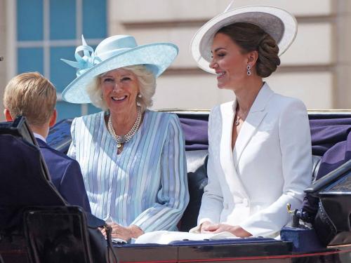 Britain's Prince George of Cambridge (L), Britain's Camilla, Duchess of Cornwall (C) and Britain's Catherine, Duchess of Cambridge (R) leave Buckingham Palace, on their way to the Queen's Birthday Parade, the Trooping the Colour, as part of Queen Elizabeth II's platinum jubilee celebrations, on June 2, 2022, in London. - Huge crowds converged on central London in bright sunshine on Thursday for the start of four days of public events to mark Queen Elizabeth II's historic Platinum Jubilee, in what could be the last major public event of her long reign. (Photo by Jonathan Brady / POOL / AFP)