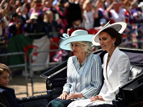 Britain's Camilla, Duchess of Cornwall (C), Britain's Catherine, Duchess of Cambridge, (R) and Britain's Prince George of Cambridge travel in a horse-drawn carriage during the Queen's Birthday Parade, the Trooping the Colour, as part of Queen Elizabeth II's platinum jubilee celebrations, in London on June 2, 2022. - Huge crowds converged on central London in bright sunshine on Thursday for the start of four days of public events to mark Queen Elizabeth II's historic Platinum Jubilee, in what could be the last major public event of her long reign. (Photo by Ben Stansall / AFP)