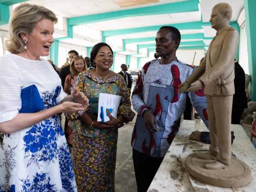 Queen Mathilde inspects a miniature sculpture of King Philippe - Filip at a round table discussion on women's rights at the Academie des Beaux-Arts, during an official visit of the Belgian Royal couple to the Democratic Republic of Congo, Thursday 09 June 2022, in Kinshasa. The Belgian King and Queen will be visiting Kinshasa, Lubumbashi and Bukavu from June 7th to June 13th. BELGA PHOTO BENOIT DOPPAGNE