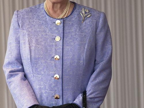 LONDON, UNITED KINGDOM - NOVEMBER 19:  Queen Elizabeth Ll Smiling During The State Visit Of The American President At Buckingham Palace.  The Queen Is Wearing A Mauve Coat With Matching Hat Which She Has Accessorized With Black Gloves And A Black Launer Handbag.  (Photo by Tim Graham Photo Library via Getty Images)