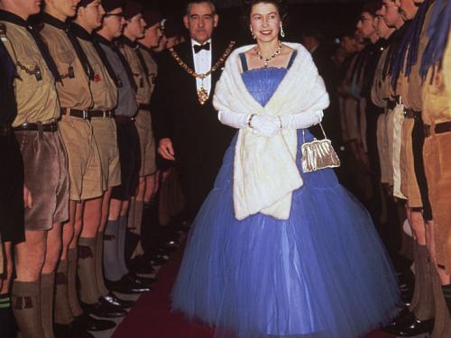 Queen Elizabeth II inspects boy scouts at a performance of the scouting revue, 'The Gang Show', 1967. (Photo by Hulton Archive/Getty Images)