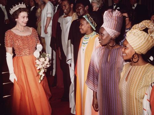 10th November 1975:  Queen Elizabeth II meeting members of the Kwa Zulu Dance Company after a Royal Variety Performance at the London Palladium.  (Photo by Hulton Archive/Getty Images)