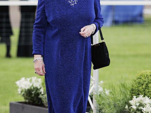 WINDSOR, ENGLAND - MAY 12: HRH Queen Elizabeth II in caftan style dress with slit front arrives for a party/dinner at the Royal Windsor Horse Show on May 12, 2006 in Windsor, England. (Photo by Tim Graham Photo Library via Getty Images)