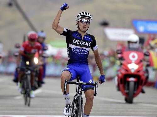 Etixx-Quick Step cyclist Gianluca Brambilla celebrates winning as he crosses the finish line ahead of Movistar's Colombian cyclist Nairo Quintana during the 15th stage of the 71st edition of "La Vuelta" Tour of Spain, a 120km route Sabinanigo to Formigal, on September 4, 2016. / AFP / JOSE JORDAN        (Photo credit should read JOSE JORDAN/AFP via Getty Images)