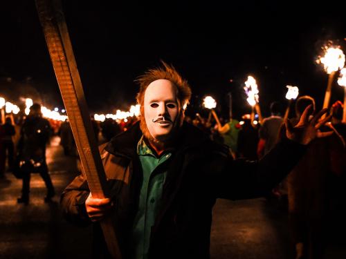 Participants take part in the Up Helly Aa festival parade through the streets of Lerwick, Shetland Islands on January 31, 2023. - Up Helly Aa celebrates the influence of the Scandinavian Vikings in the Shetland Islands and culminates with up to 1,000 'guizers' (men in costume) throwing flaming torches into their Viking longboat and setting it alight later in the evening. (Photo by Andy Buchanan / AFP)