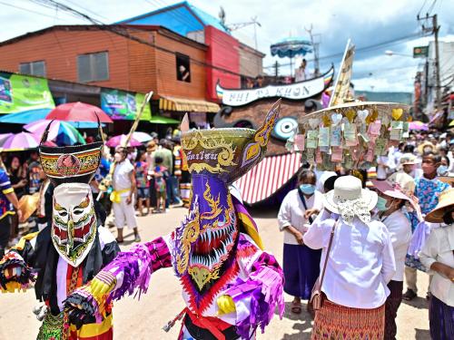 Participants wearing ghost masks and colorful costumes take part in parade during the annual Phi Ta Khon carnival or ghost festival in Dan Sai district in northeastern Thailands Loei Province on June 24, 2023. (Photo by MANAN VATSYAYANA / AFP)