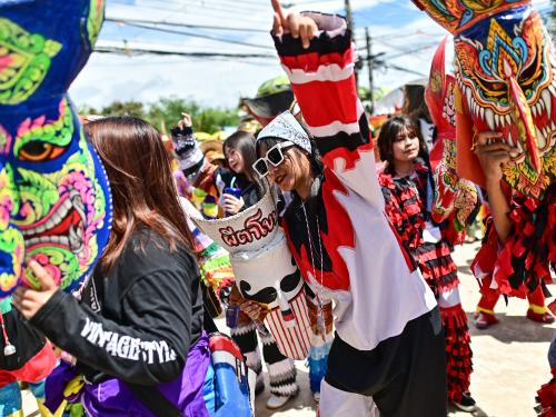 Participants wearing ghost masks and colorful costumes take part in the annual Phi Ta Khon carnival or ghost festival in Dan Sai district in northeastern Thailands Loei Province on June 24, 2023. (Photo by MANAN VATSYAYANA / AFP)