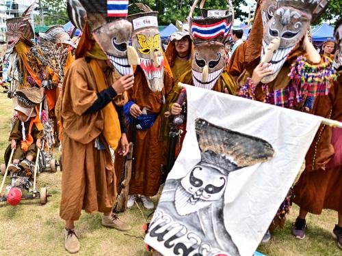 Participants wearing ghost masks and colorful costumes take part in the annual Phi Ta Khon carnival or ghost festival in Dan Sai district in northeastern Thailands Loei Province on June 24, 2023. (Photo by MANAN VATSYAYANA / AFP)