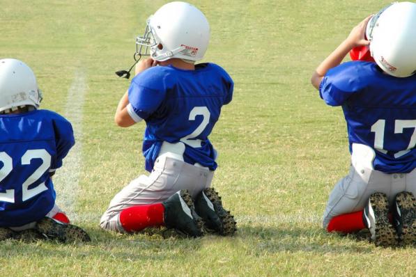 Drie Amerikaanse football players dividend aandelen