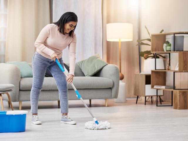 Woman Mopping Living Room Floor