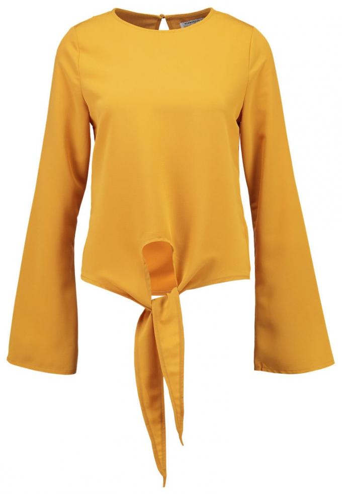 Gele blouse met strik vooraan