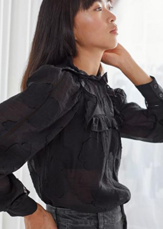 Zwarte blouse met print in reliëf en ruches