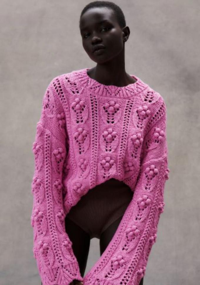 Oversized tricot trui met pompons in roze