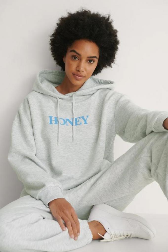 Sweater met quote