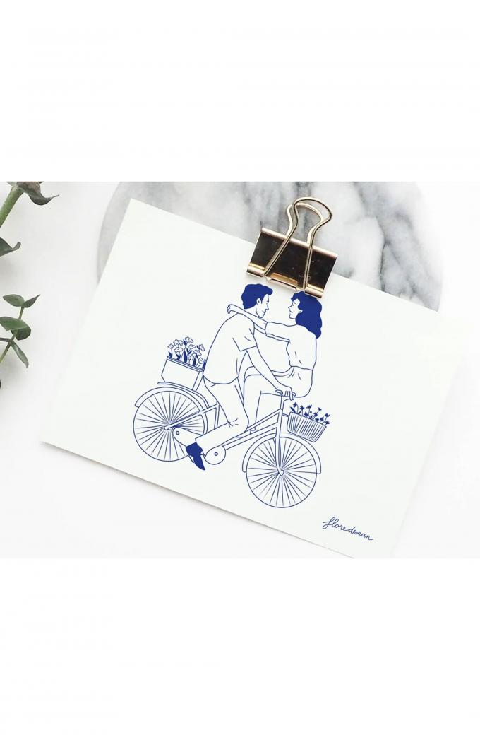 Geïllustreerde wenskaart met koppel op fiets