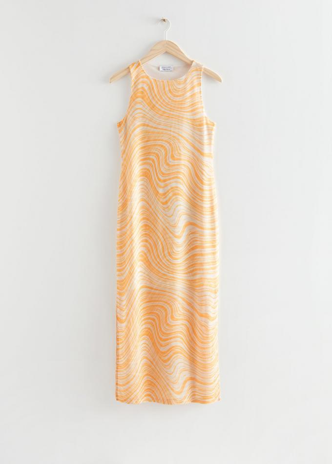 Midi-jurk met oranje-witte swirls en een split
