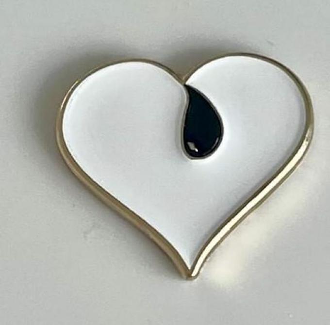 “Je mag je rouwend hart tonen. En dan zal je hart een tijdje anders kleuren: zwart, wit en goud”.