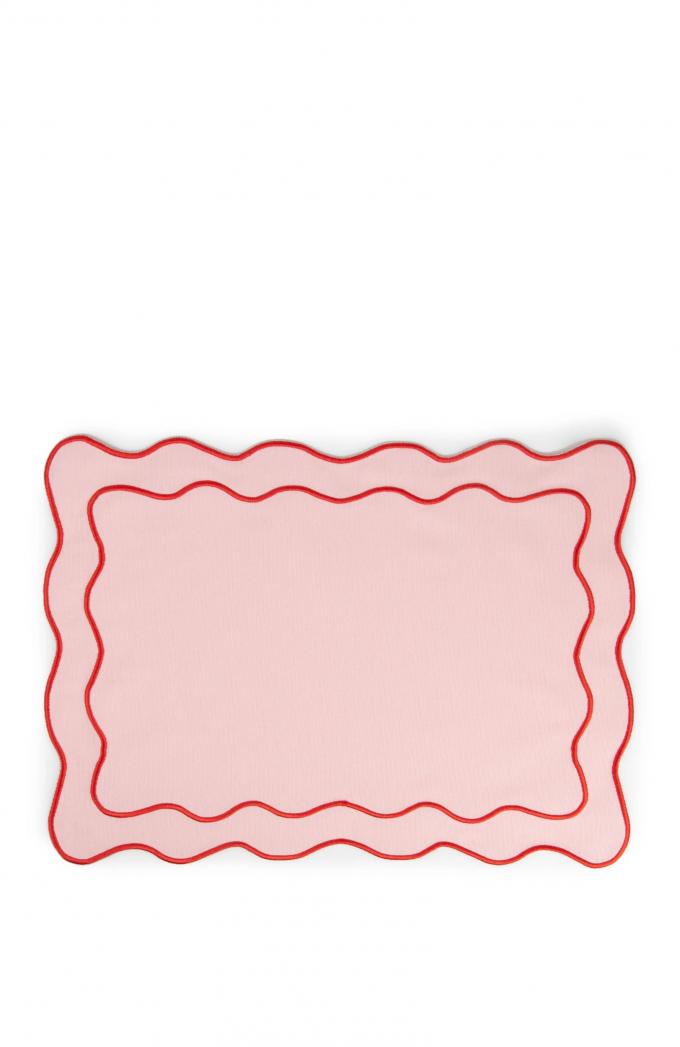 Roze placemat met geborduurde golvende rand (50 x 35 cm)