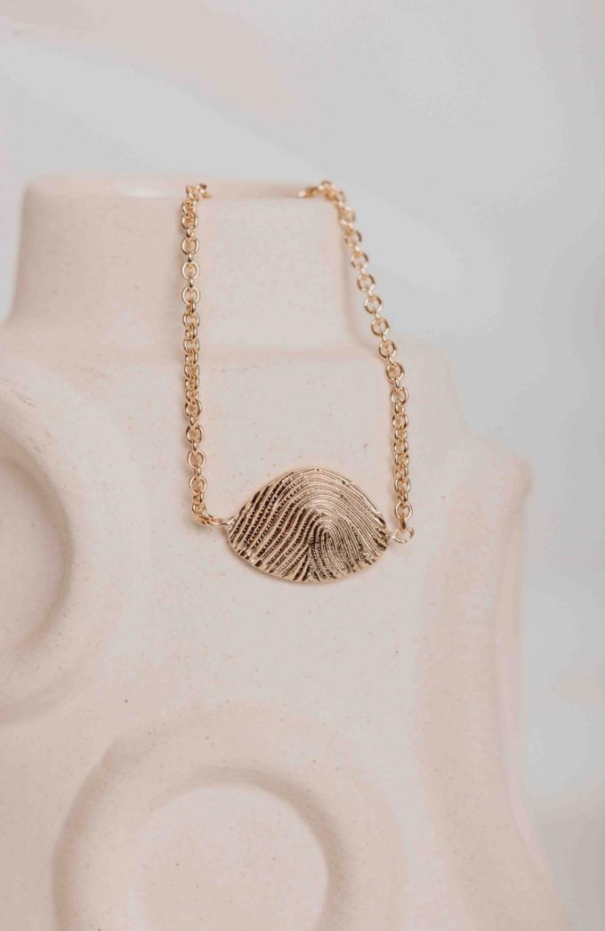 Armband met vinger- of teenafdruk 