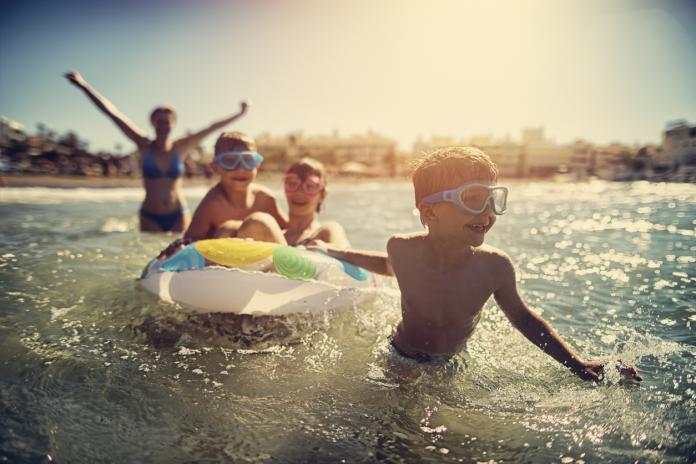 Family having fun in summer sea