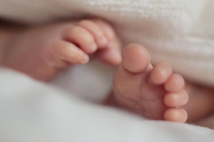 Both of feet of sleeping baby