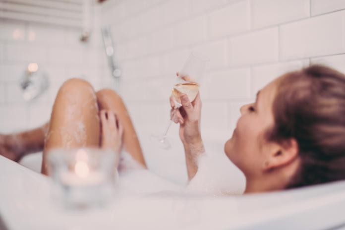 Woman enjoying a bath.