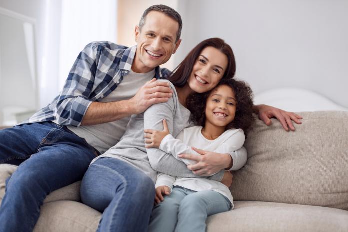 Inspired family sitting on the sofa