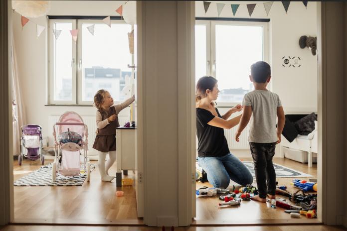 Mother and kids cleaning house